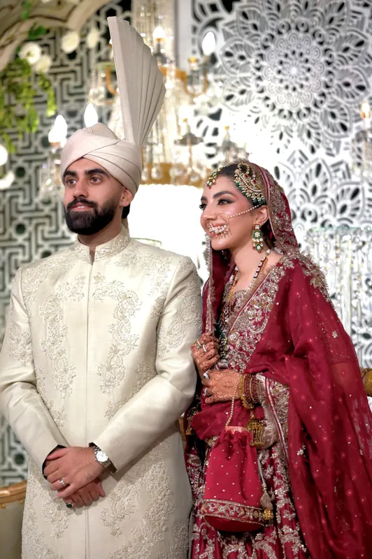 Family and friends celebrating together at a Pakistani wedding in Islamabad, candid wedding photography by Arsalan Asad