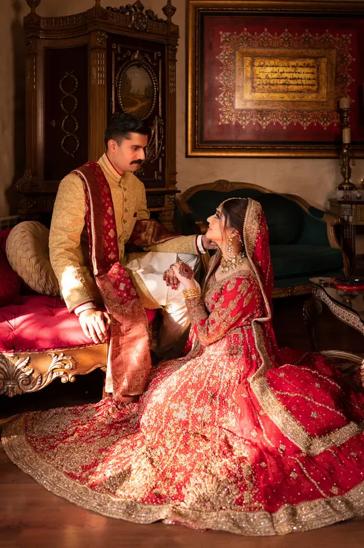 Wedding portrait in soft candlelight, captured during a late-night celebration in Islamabad by Arsalan Asad