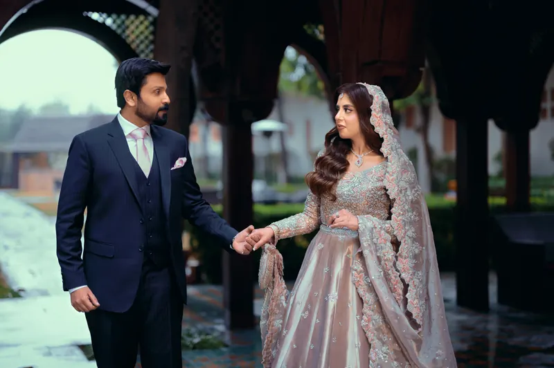 Wide wedding scene with guests in soft evening light, wedding photography in Islamabad